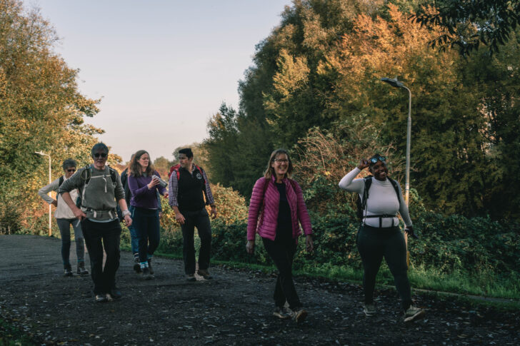 Group of people walking on a countryside path