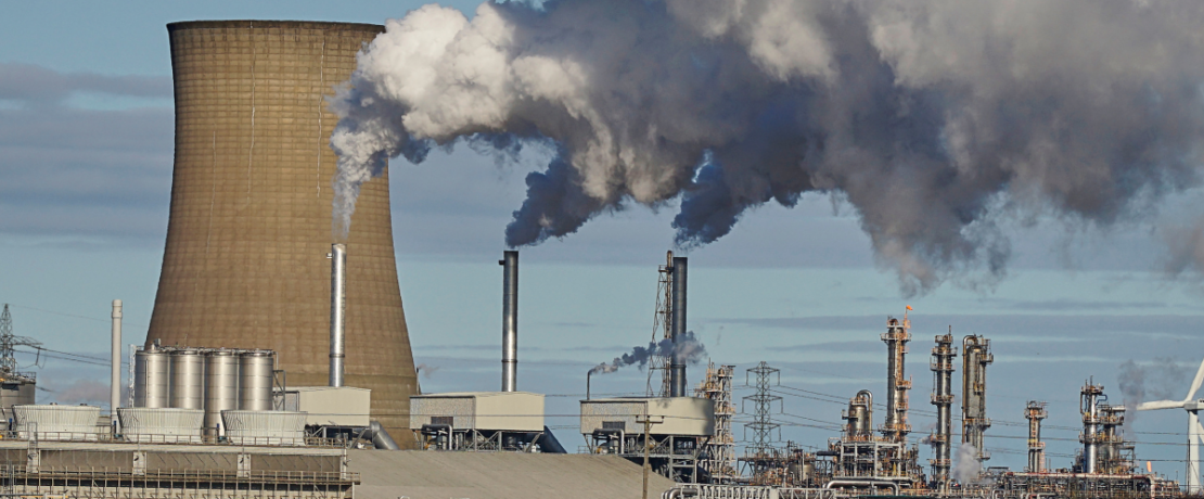 Photo of a power station and gas being emitted