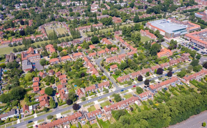 Aerial photo of the British town of Stevenage in Hertfordshire UK showing a typical British housing estate with rows of houses in the village