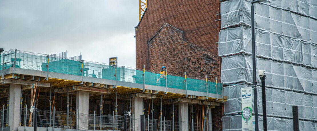 A building under construction with scaffolding around it