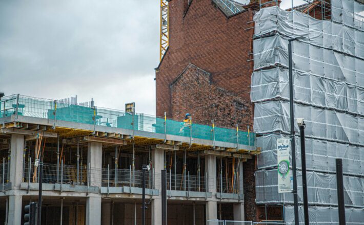 A building under construction with scaffolding around it