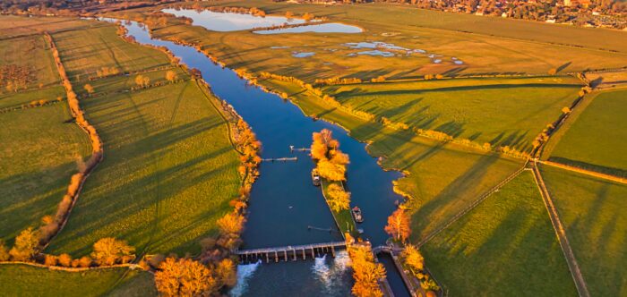 aerial photography of river and open field during daytime