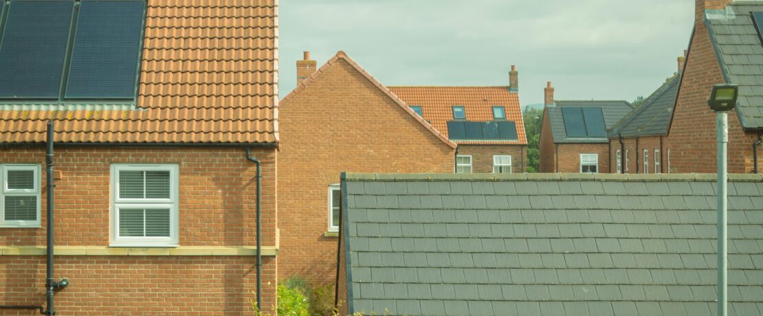 Houses with solar panels on roof
