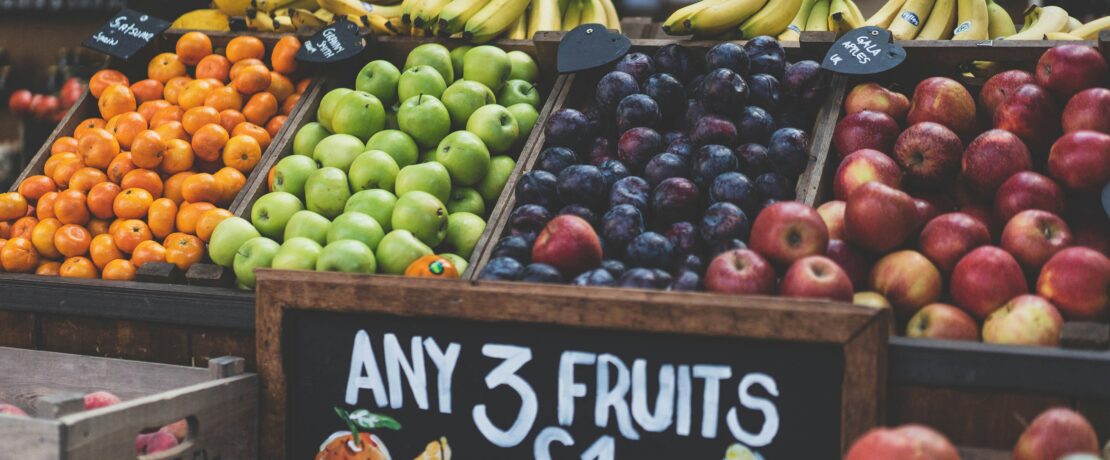 bunches of fruits for sale on a stall