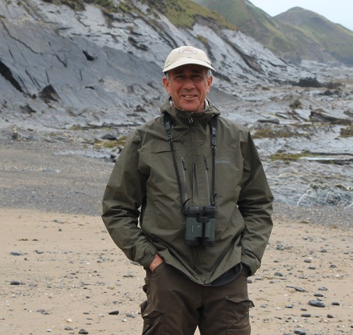 A man stands in a costal region