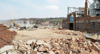 Demolition of a factory and clearing a plot of brownfield land.